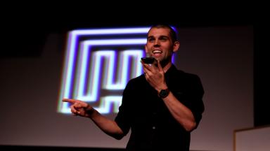 Brice on stage with phone