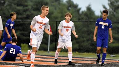 Georgetown players celebrate scoring goal