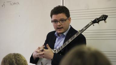 Daxson Lewis talking to students