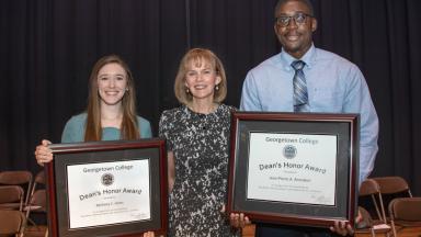 Jean-Pierre Amoakon and Bethany Jones pose with Dean's Award with Dr. Rosemary Allen.